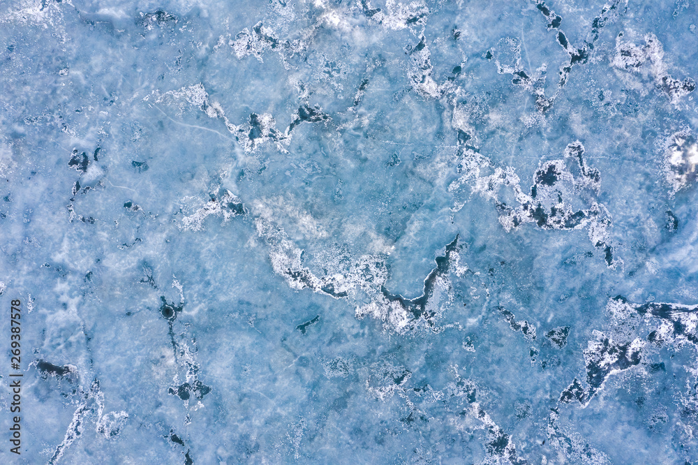 Aerial view of frozen lake. Drone view. Background texture concept.