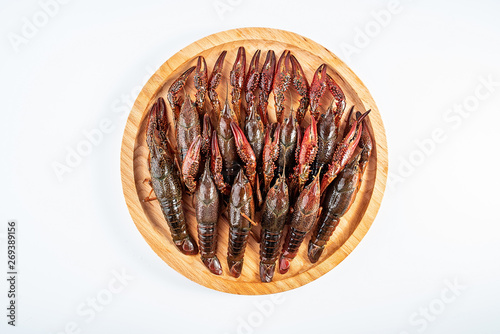 Crayfish with a dish cleaned on a white background