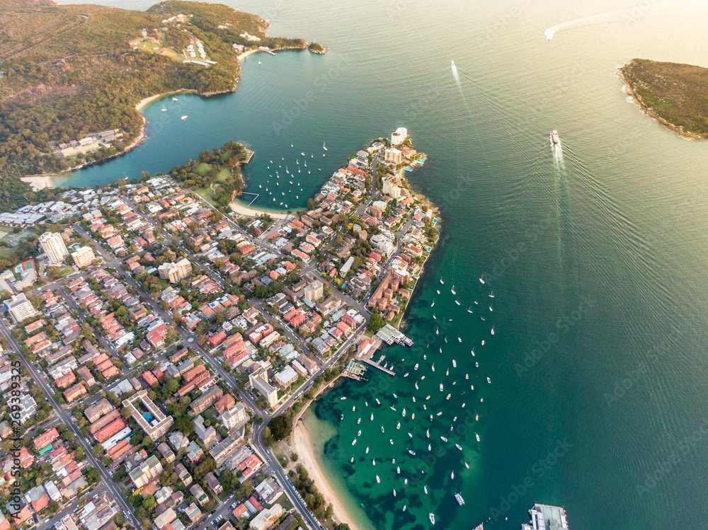 Aerial drone evening view of the Sydney suburb of Manly, a beach-side suburb of northern Sydney, in the state of New South Wales, Australia, with Manly Harbour, Little Manly Beach and Collins Beach.
