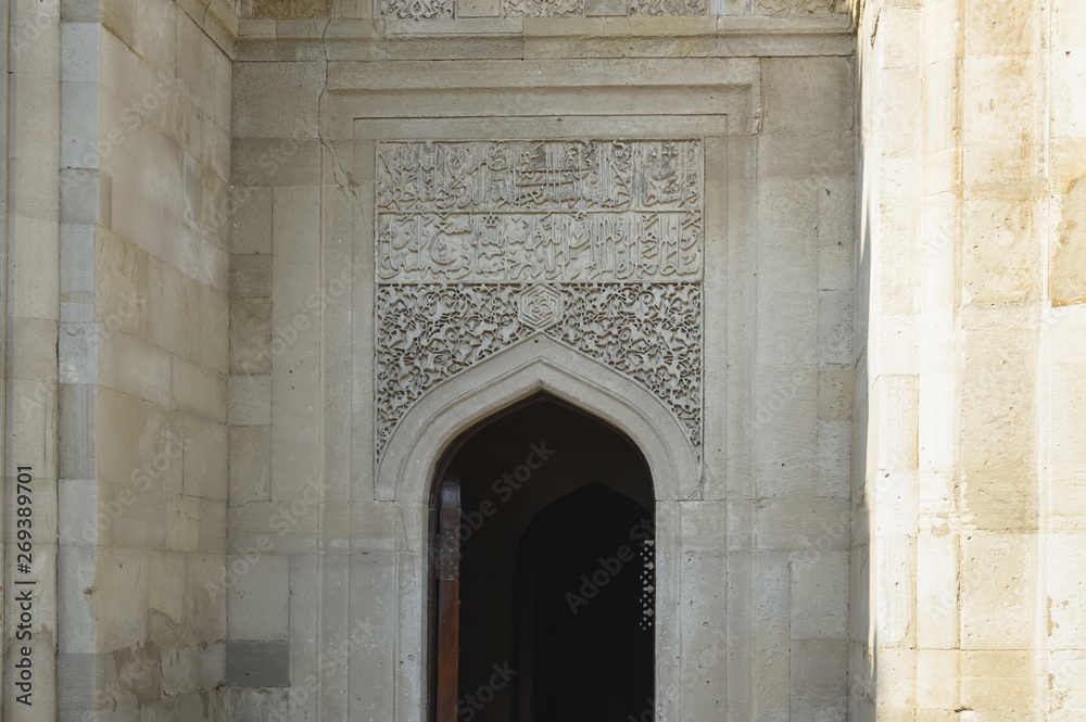 antique door decor on the wall of shirvanshah palace