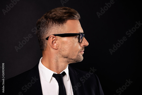 Close-up portrait of his he nice attractive content intelligent guy executive director shark ceo boss chief sales agent broker expert specialist isolated over black background
