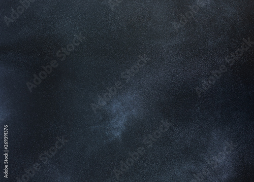 Abstract black background with white powder and stone texture