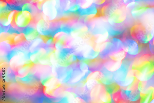 Colorful blurred bokeh background of holiday lights. Festive greeting card. New year and Christmas texture