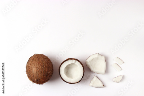 broken coconut on a white background top view.