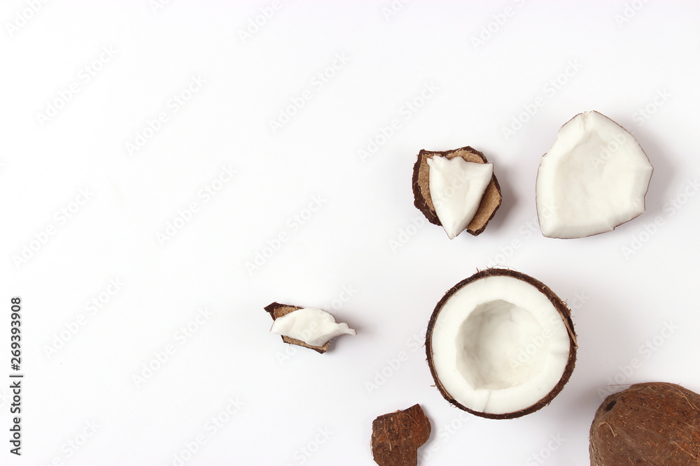 broken coconut on a white background top view. - obrazy, fototapety, plakaty 