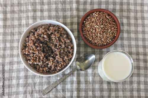 Buckwheat porridge with milk and butter. Healthy breakfast or snack. Dietary food.