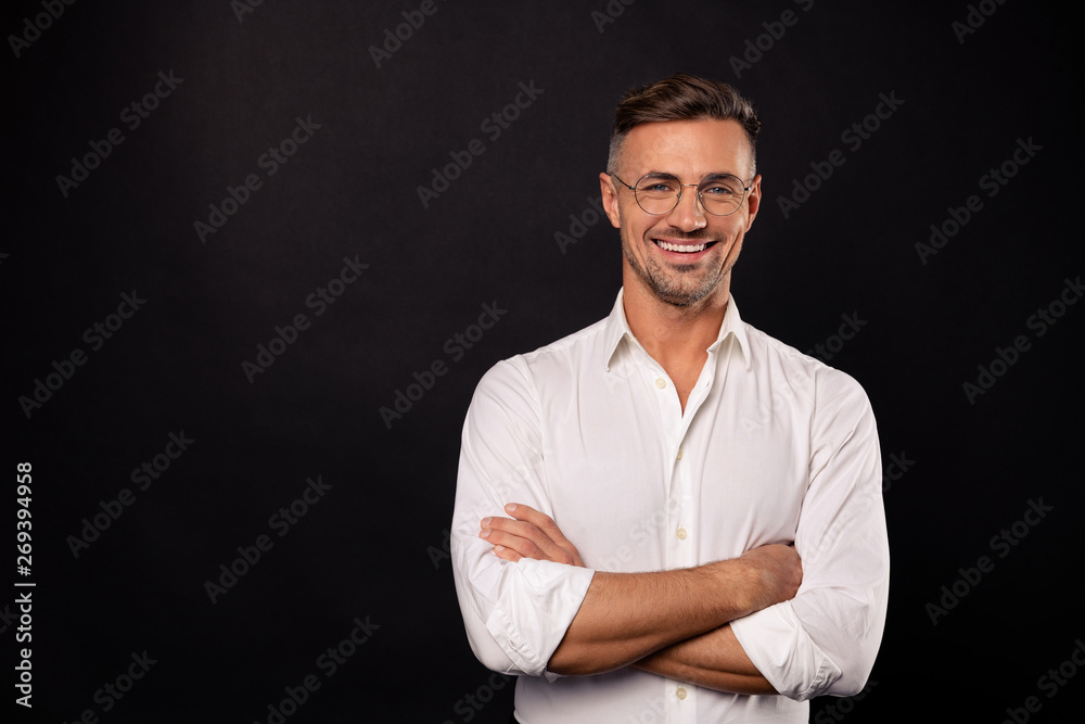 Portrait of his he nice attractive content cheerful cheery guy geek it team lead consulting specialist expert shark employee career folded arms isolated over black background Portrait of his he nice attractive content cheerful cheery guy geek it team lead consulting specialist expert shark employee career folded arms isolated over black background