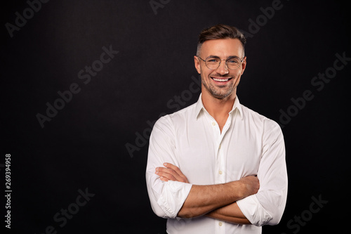 Portrait of his he nice attractive content cheerful cheery guy geek it team lead consulting specialist expert shark employee career folded arms isolated over black background