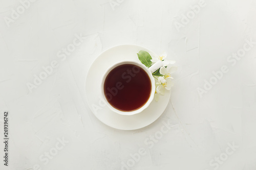 cup with tea on a white textural background