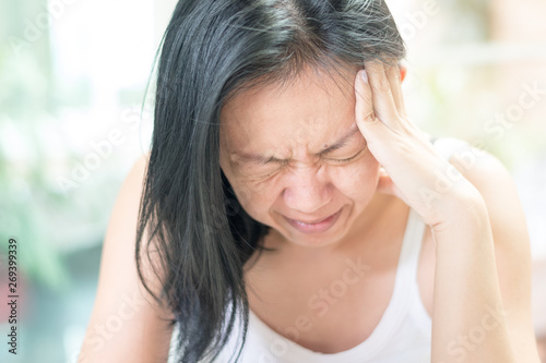 Brain diseases problem cause chronic severe headache migraine. Female adult look tired and stressed out depressed, having mental problem trouble, medical concept photo