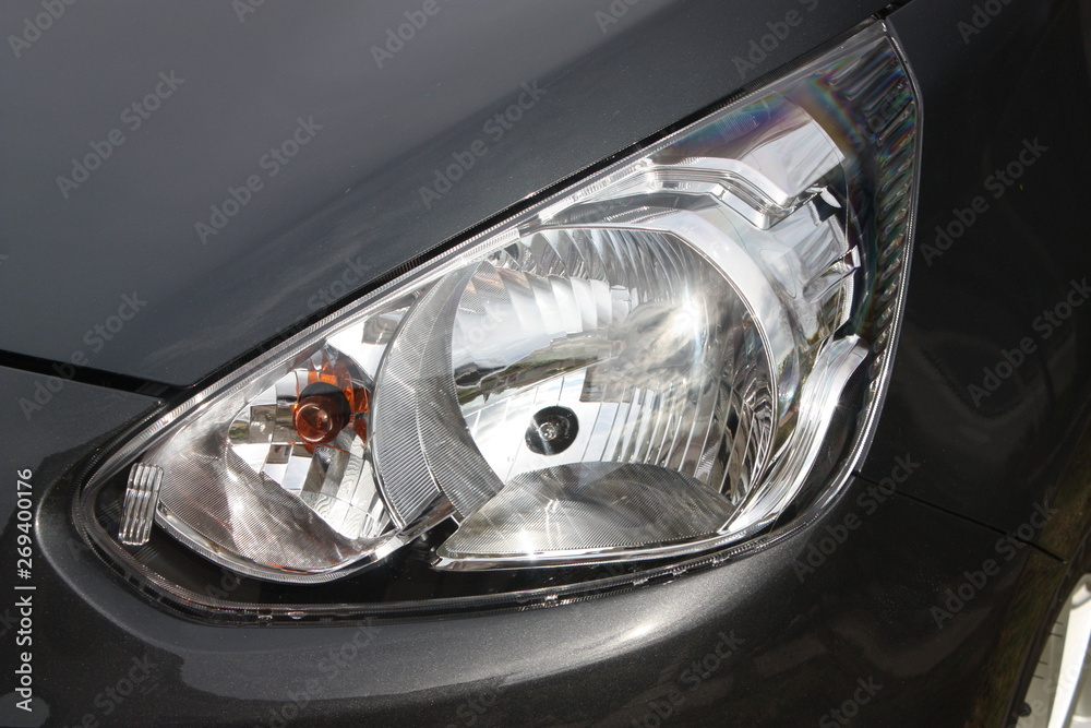 Grey budget vehicle headlight cluster
