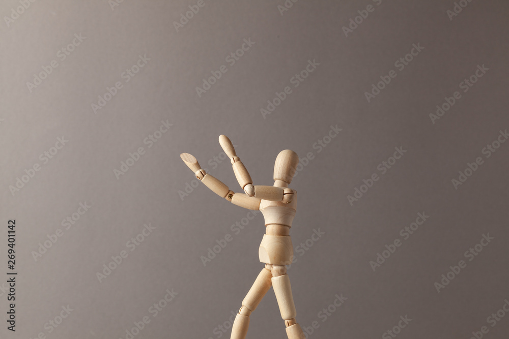 Man stretches his hand up on gray background. Man stretches his hand up on gray background.