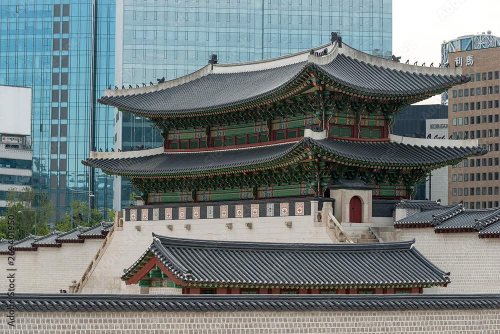 Traditional building with modern skyscrapers in background, Seoul, South Korea Traditional building with modern skyscrapers in background, Seoul, South Korea