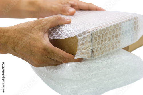 hand of man hold bubble wrap, for protection parcel product cracked or insurance During transit