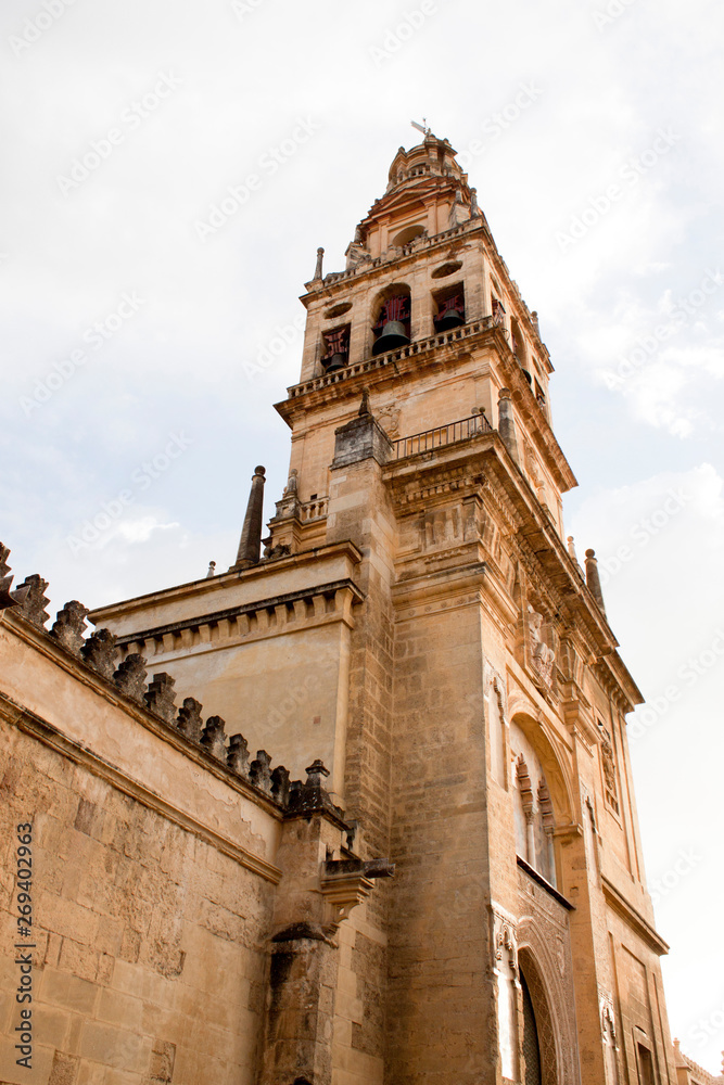 Fototapeta premium iluminated tower in cordoba mosque from down to the sky in Spain