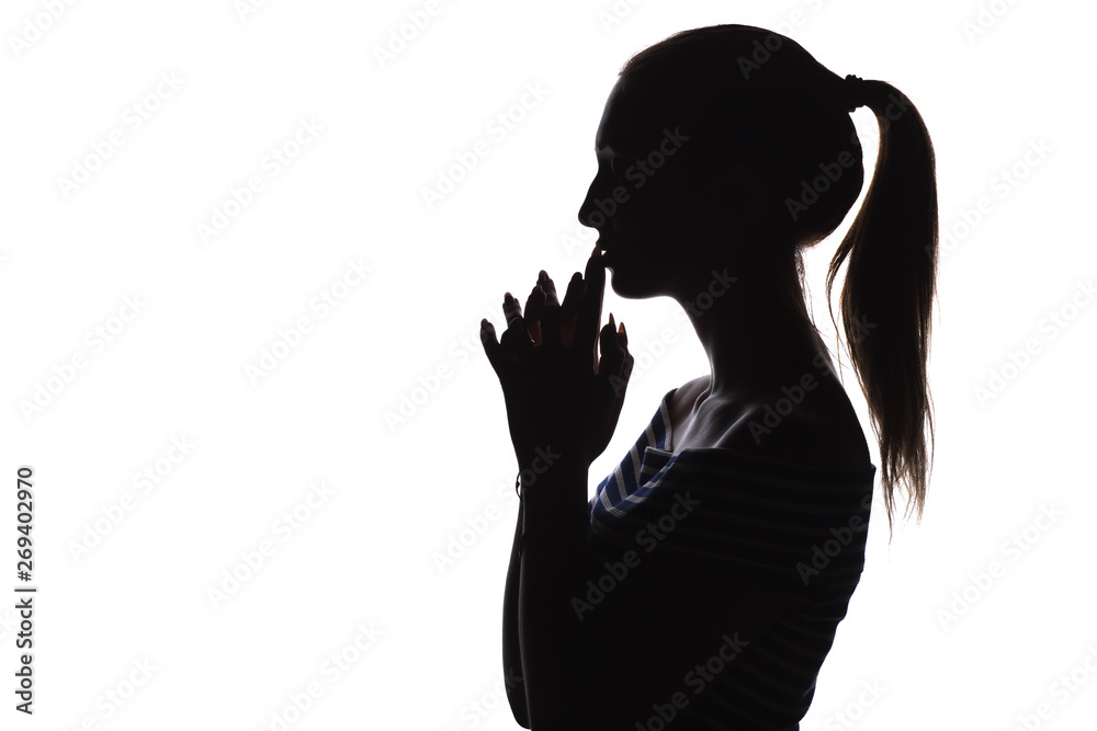 silhouette of serious thoughtful girl with arms folded near the china teenager, unrecognizable woman face profile on a white isolated background,, concept age, problems, religion, life