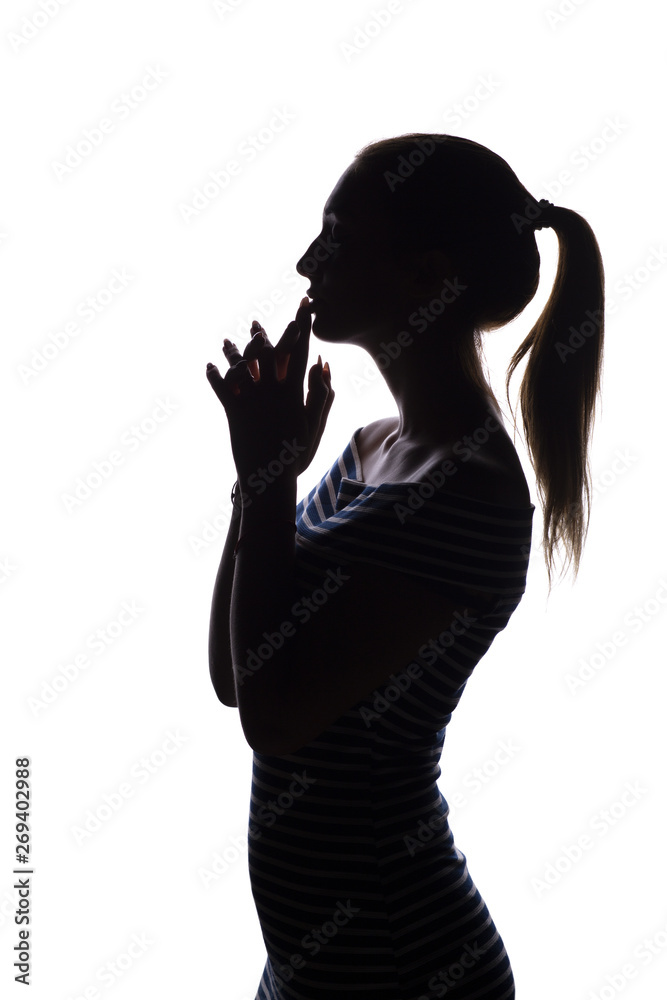silhouette of serious thoughtful girl with arms folded near the china teenager, woman face profile on a white isolated background,, concept age, problems, religion, life