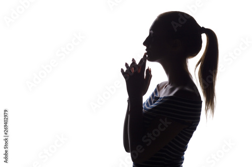 silhouette of serious thoughtful girl with arms folded near the china teenager, woman face profile on a white isolated background,, concept age, problems, religion, life