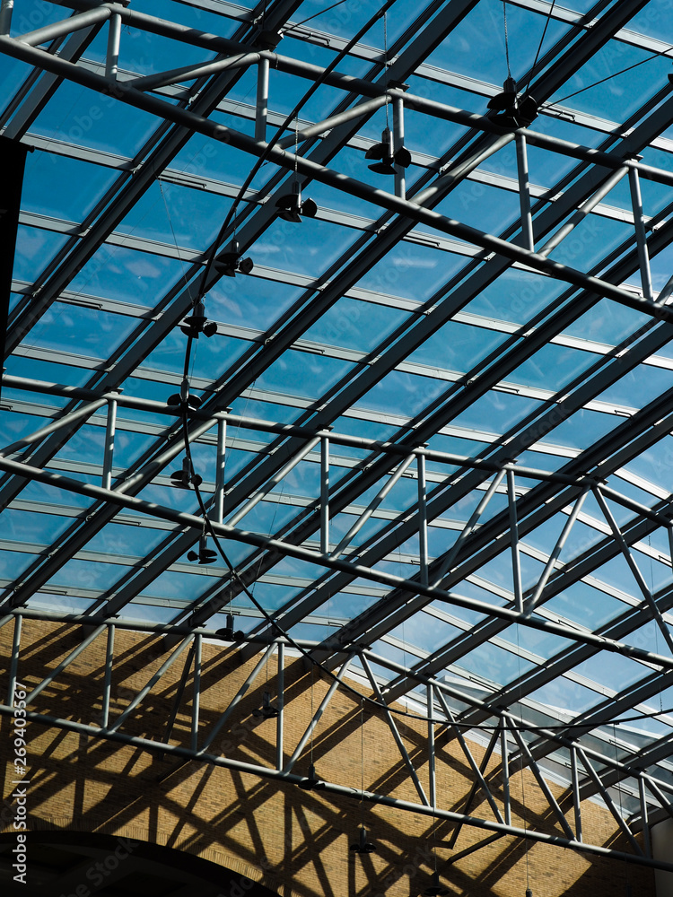 An abstract metal structure under the roof of the mall An abstract metal structure under the roof of the mall