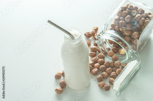 vegan milk in glass jar on white background