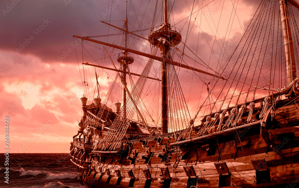 Re-production of a galleon in public site in Genova, Italy, stormy sky  - obrazy, fototapety, plakaty 