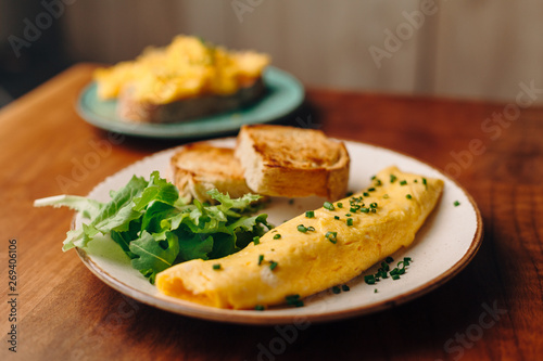 French rolled omelette with chives on a plate