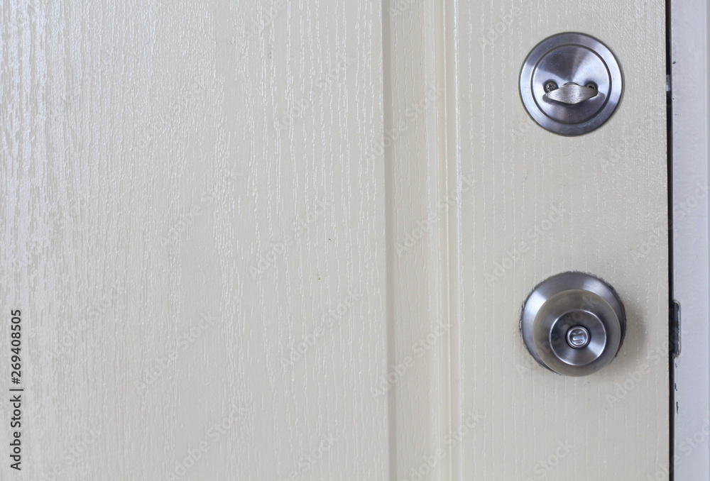 white door with lock and deadbolt for safety security insurance protection. white door with lock and deadbolt for safety security insurance protection.
