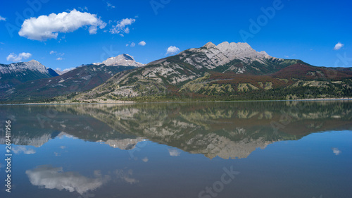 Reflection of mountains in Jasper Lake, Yellowhead Highway, Jasper National Park, Jasper, Alberta, Canada © klevit