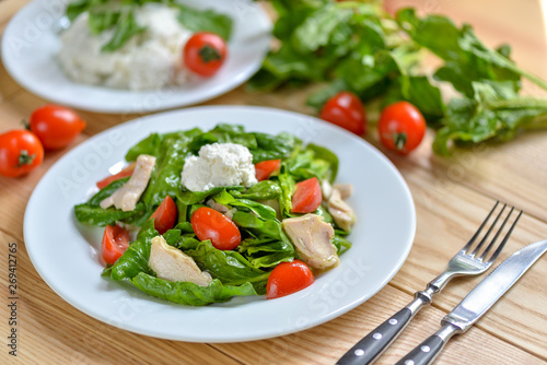 Fototapeta Naklejka Na Ścianę i Meble -  fresh spinach salad with tomatoes cheese