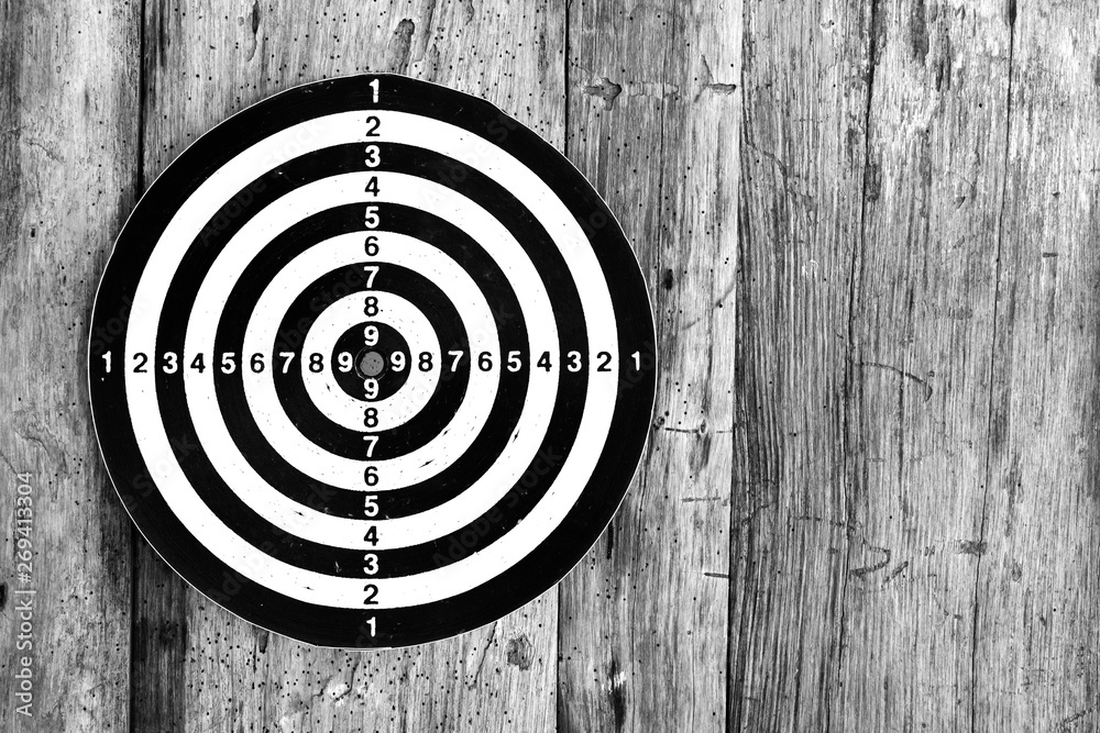 Bullseye is a target of business. Dart is an opportunity and Dartboard on old wood background