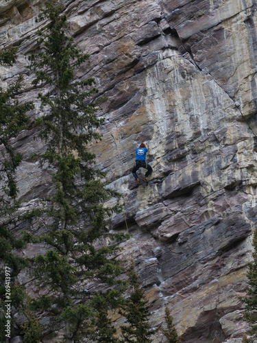 Person climbing rock, Lake Louise, Improvement District 9, Banff National Park, Alberta, Canada