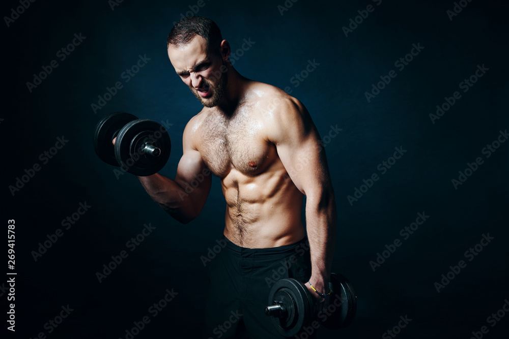 Strong sport sirtless man making weightlifting with dumbbells