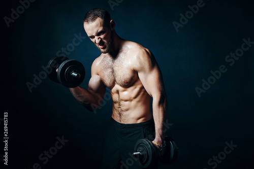 Strong sport sirtless man making weightlifting with dumbbells © paffy