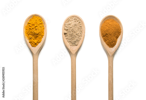  Photos Wooden Spoon filled with various spices on white background