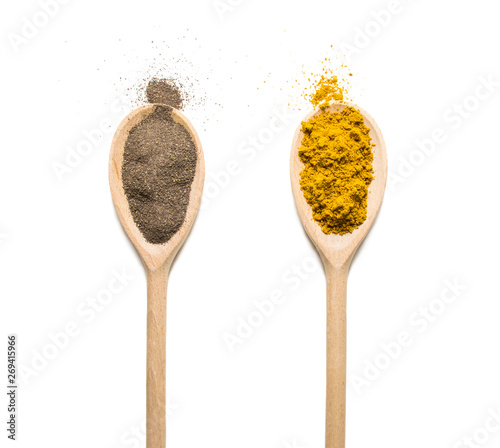  Photos Wooden Spoon filled with various spices on white background