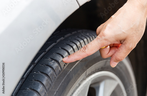 Close up of woman hand poin to nail stab at the tire © JU.STOCKER