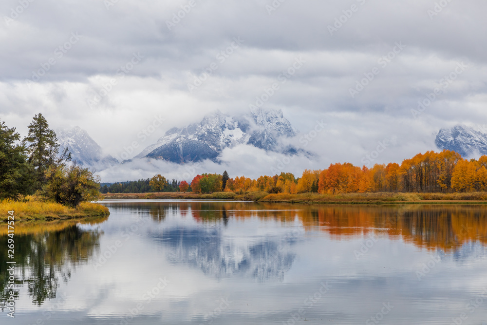 Scenic Reflection of the Tetons in Autumn