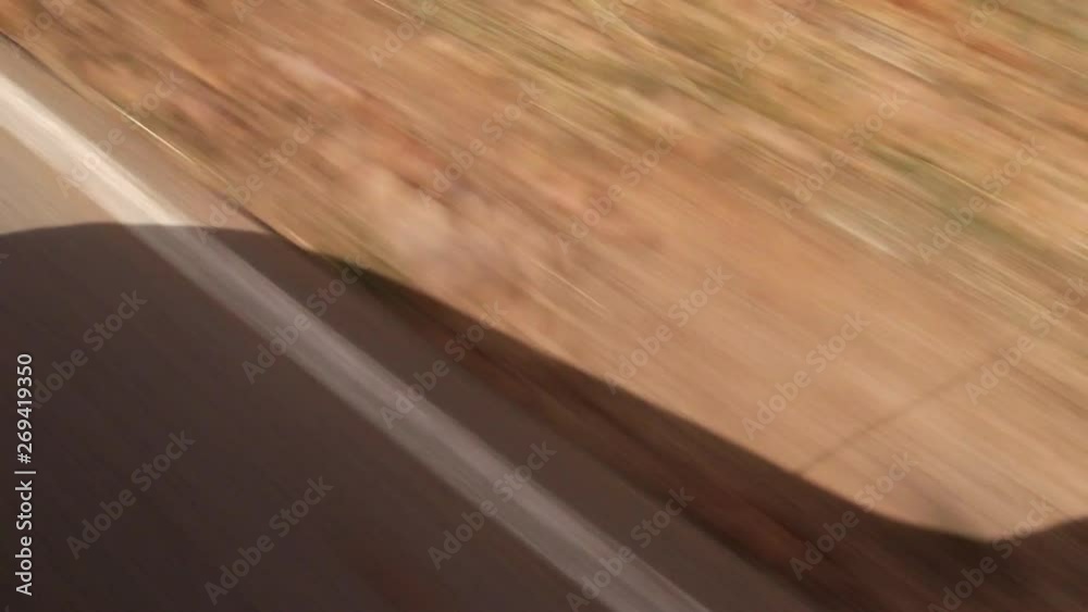 car mirror shadow passing by red ground car mirror shadow passing by red ground