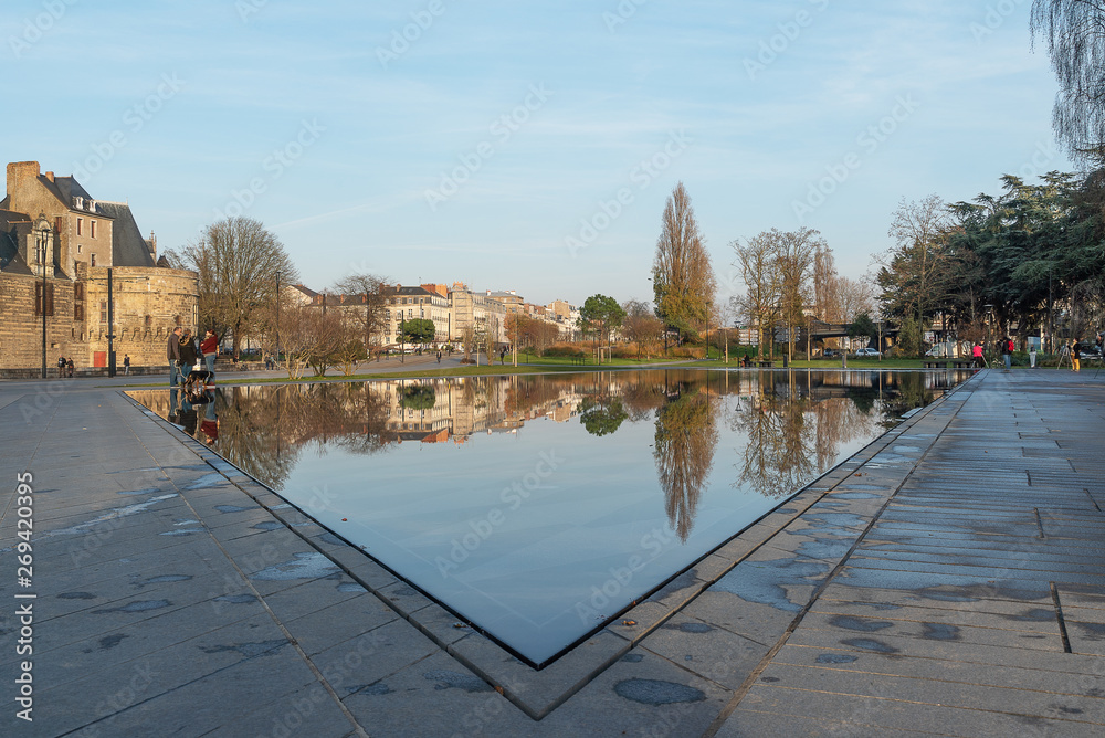 the mirror of water on the esplanade of the castle of the Dukes of Brittany in Nantes