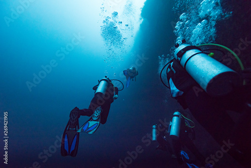 Scuba divers underwater, The Great Blue Hole, Belize Barrier Reef, Lighthouse Reef, Belize photo
