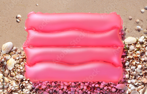 Summer background with sand and shells.