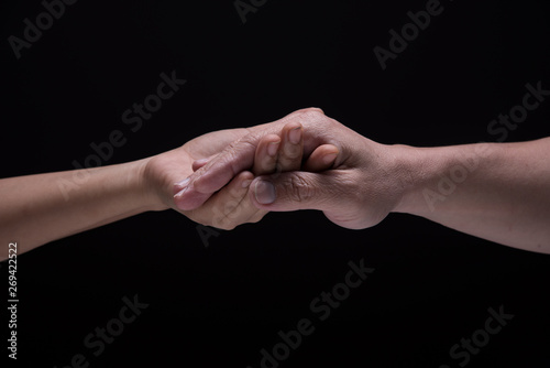 Fototapeta Naklejka Na Ścianę i Meble -  Hand hold together mean be in take care, agreement,power and friendship.