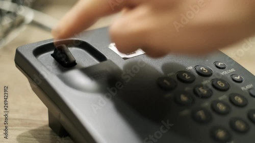 Man wants to make a wired phone call