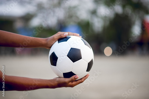 The cropped image of sports players who catch the ball and the football field. Sports-image concept. © FOTO SALE