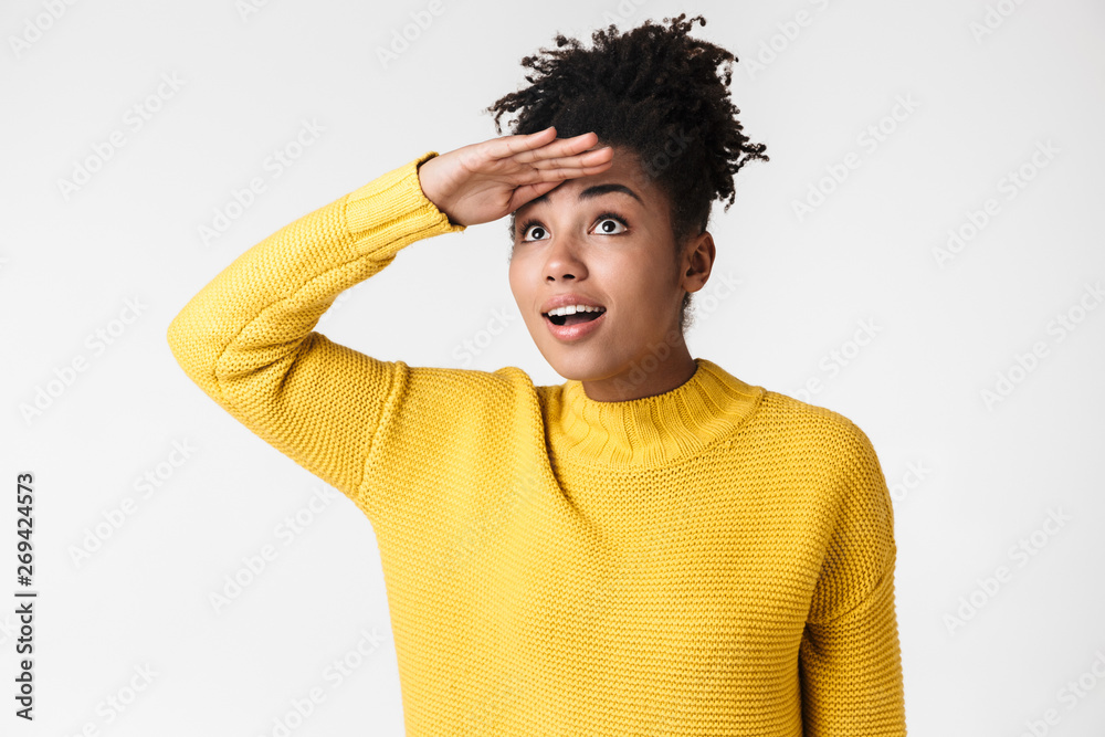 Image closeup of cute african american woman looking upward with hand on forehead