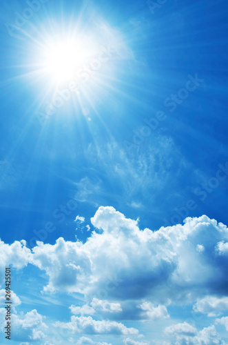 blue sky with white clouds and sun