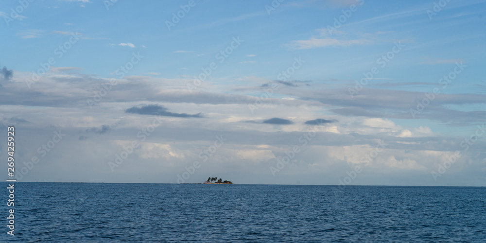 Seascape with island in the background, Caribbean Sea, Belize Seascape with island in the background, Caribbean Sea, Belize