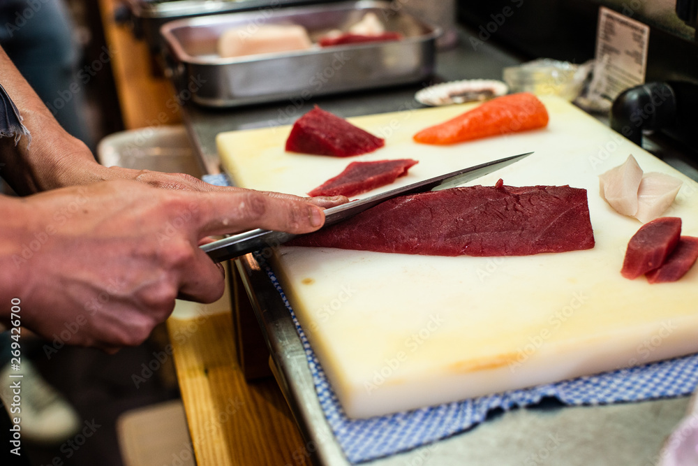 preparing and cooking sushi satshimi for japanese food