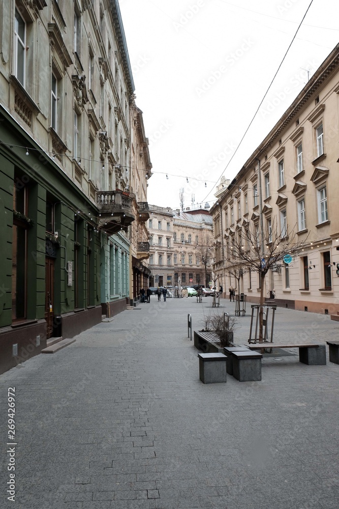 Obraz premium Narrow courtyards in the city, the old stone road. Street in the city of Lviv Ukraine 03.15.19