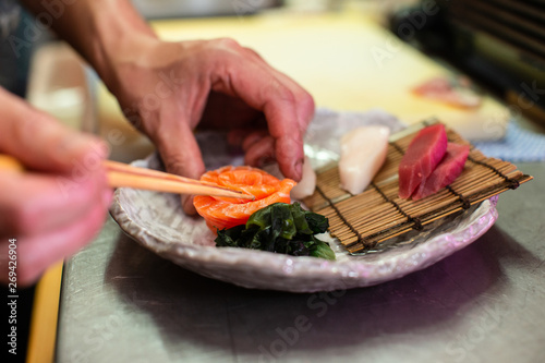 preparing and cooking sushi satshimi for japanese food